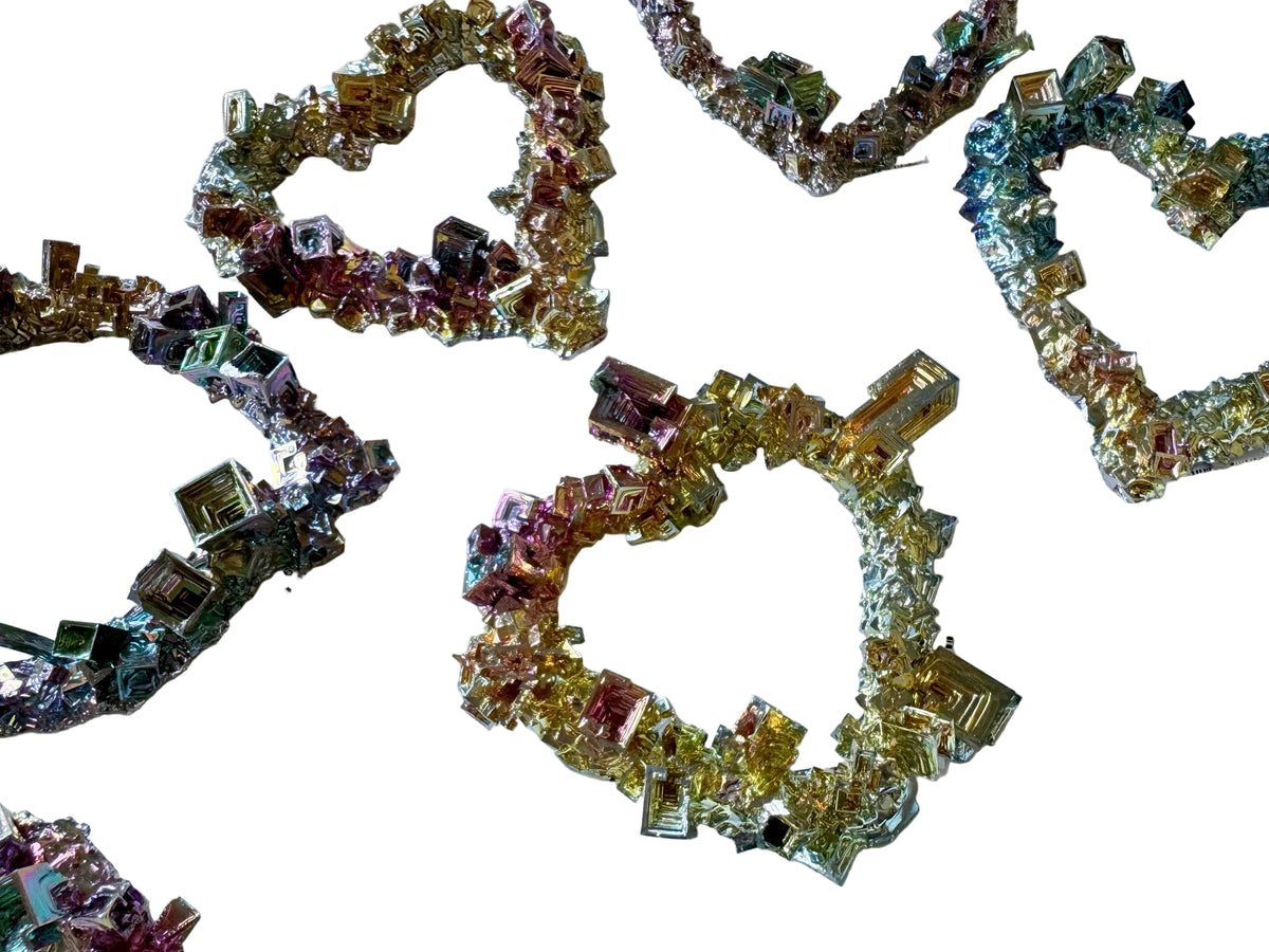 Decorative letters spelling 'LOVE' made of small colorful crystals on a white background