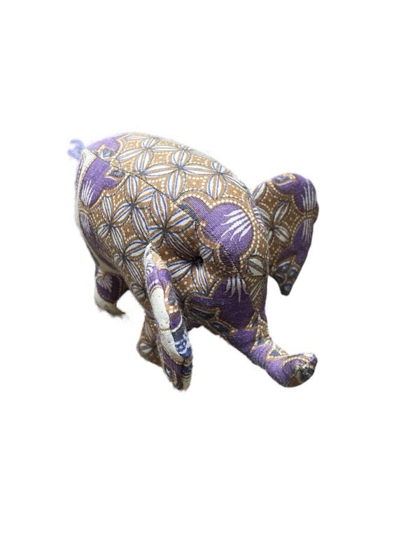 Decorative elephant figurine with a purple and gold pattern on a white background