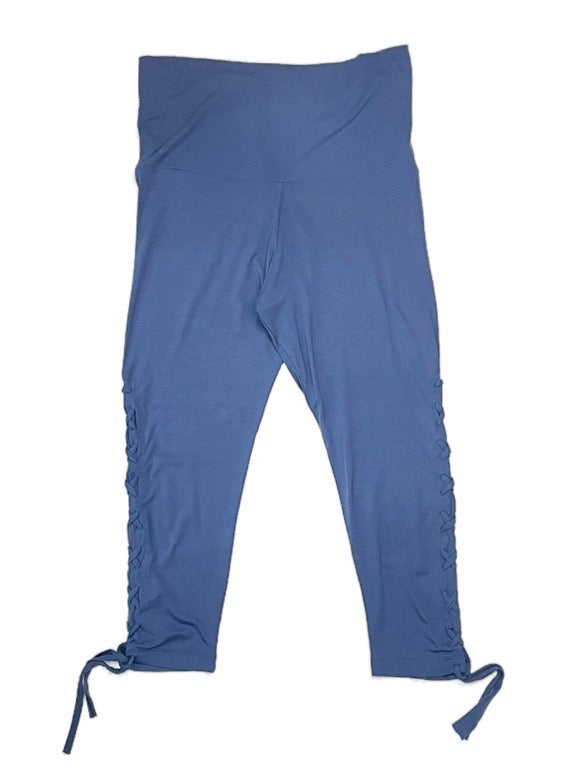 A blue 3/4 length legging with side lace up details.