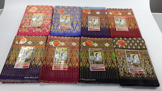 Set of decorative packages with intricate designs and portraits on a white surface
