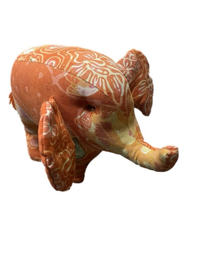 Decorative elephant with floral patterns on a white background