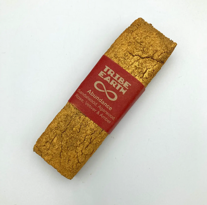 Bar of soap with a red label featuring 'Tribe Earth' on a white background